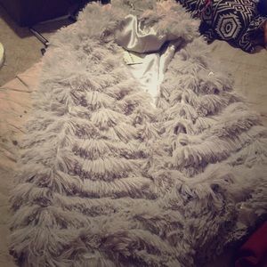 It’s a sleeveless coat.